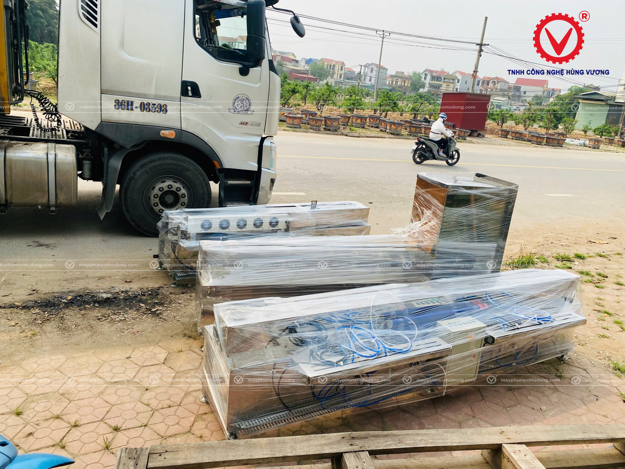 bàn giao máy phun sơn tự động